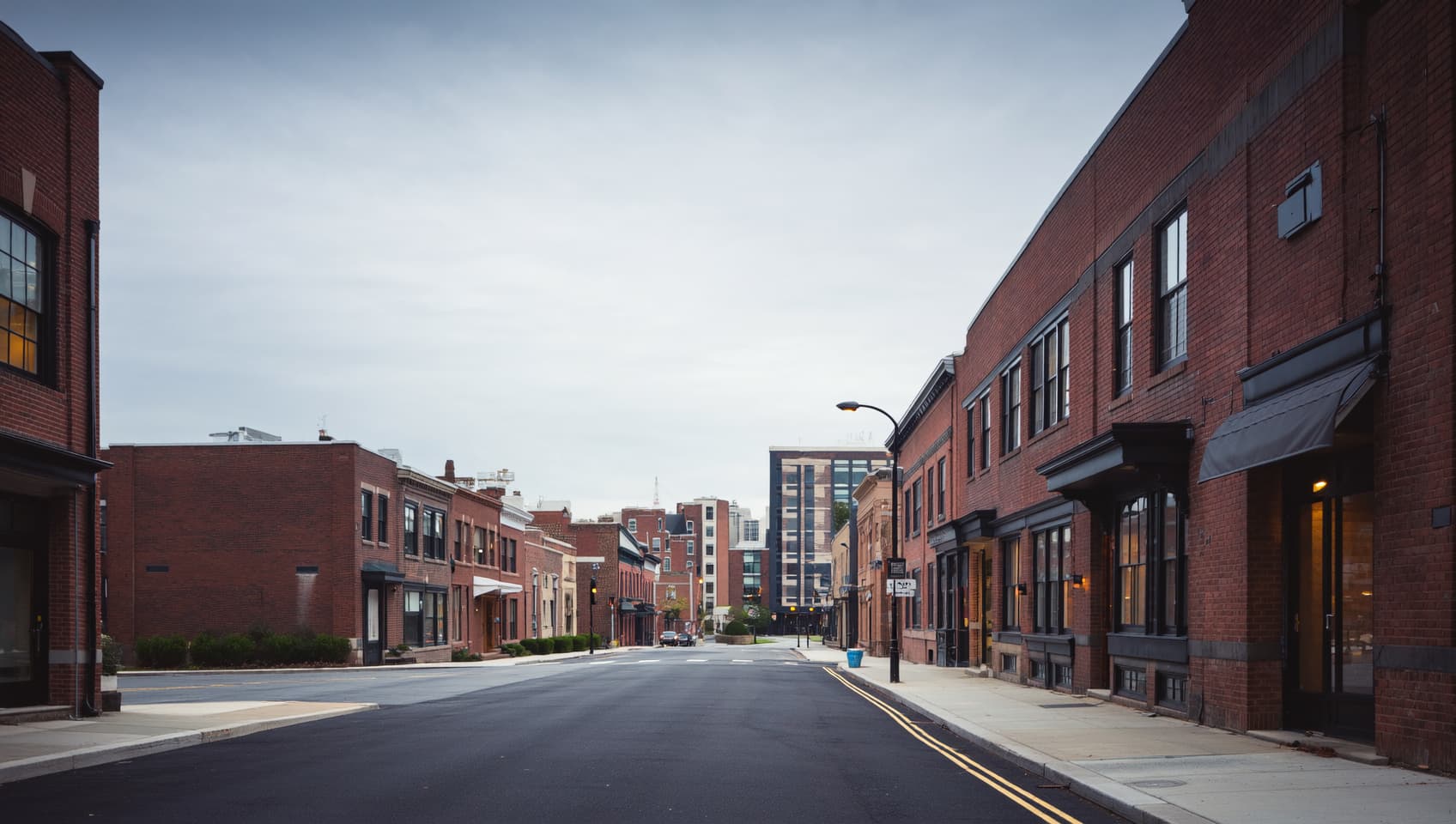 Quiet downtown Hackensack New Jersey street with low brick professional buildings under overcast daylight